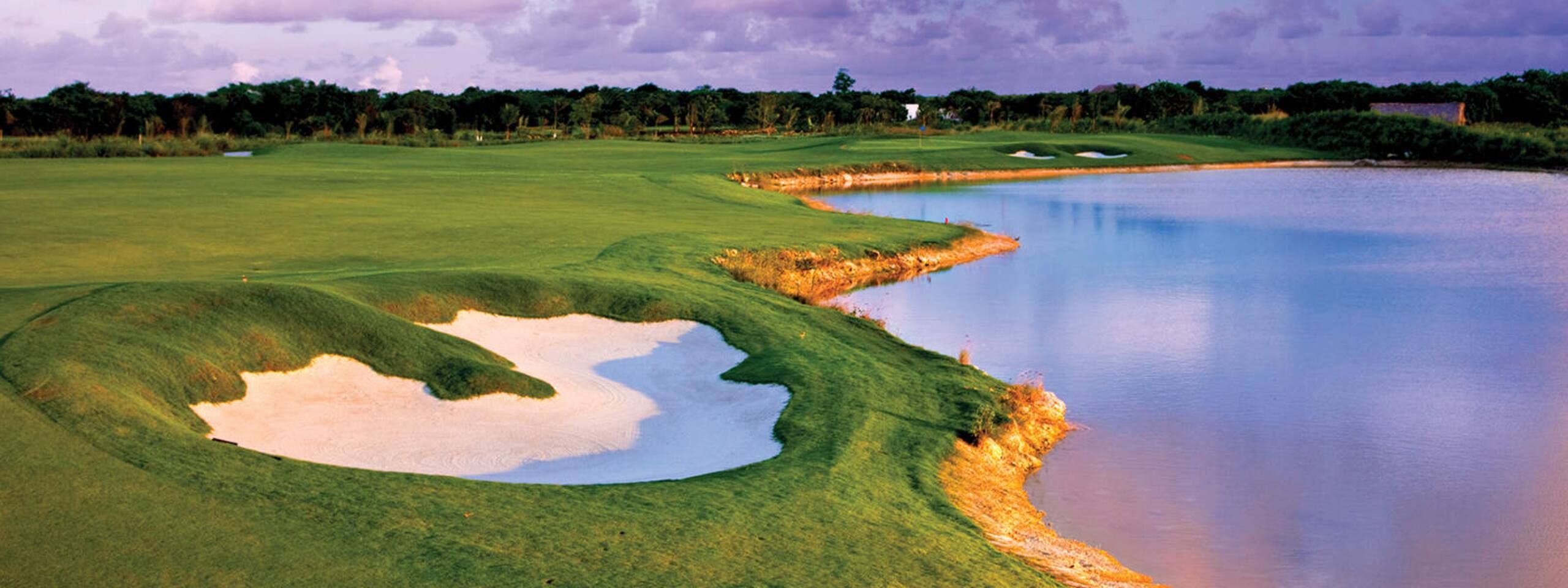 Bunker and lake on a fairway at Hard Rock Golf Club at Cana Bay